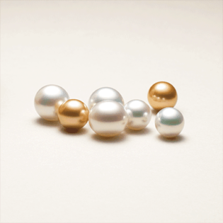 Round white and golden South Sea pearls Asia Pearl Japan Ltd