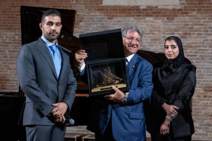 From left Ghanim al-Saadi, Director, QDE; Dr Gaetano Cavalieri; and Al Hanoof Al Malki, Business Development Associate, QDE. Cavalieri accepted a QDE gift on behalf of CIBJO fo
