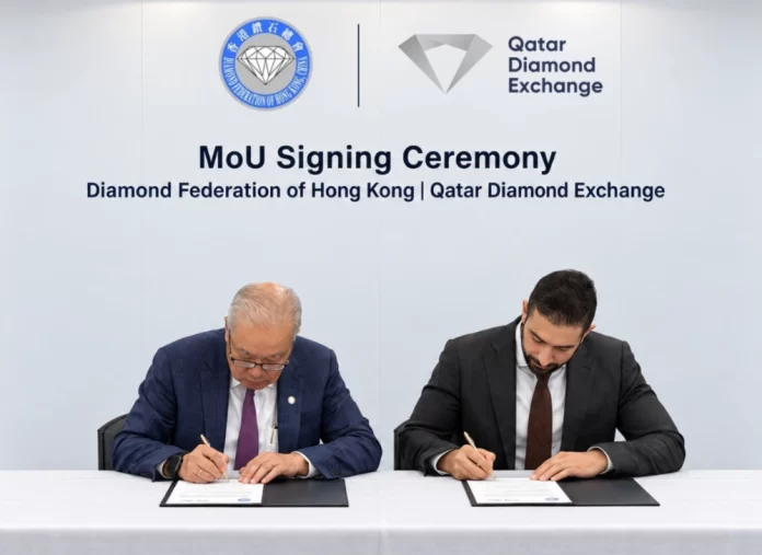 Lawrence Ma (left) and Ghanim al-Saadi signing the Diamond Federation of Hong Kong-Qatar Diamond Exchange MoU
